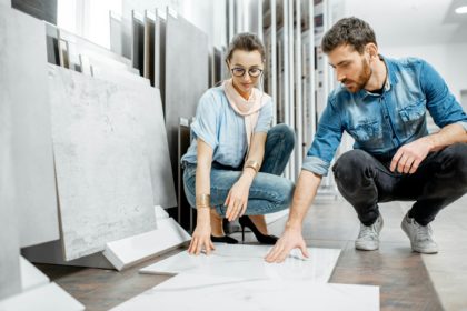 Couple choosing tiles in the shop