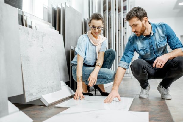 Couple choosing tiles in the shop