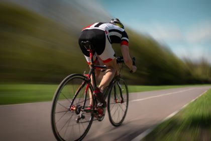 Cyclist rides on bicycle, speed effect