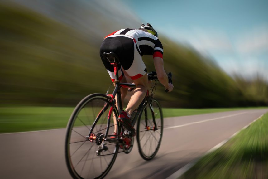 Cyclist rides on bicycle, speed effect